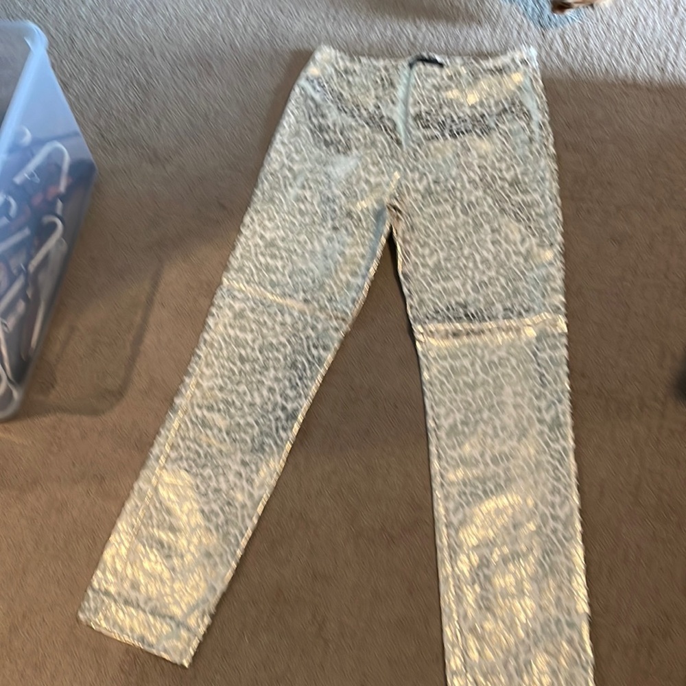 Shiny animal print pants.